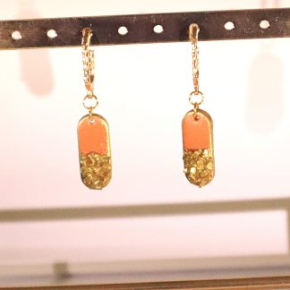 Orange hangers with golden stone details