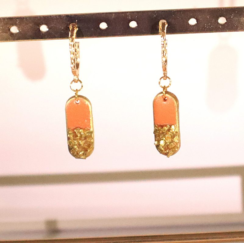 Orange hangers with golden stone details