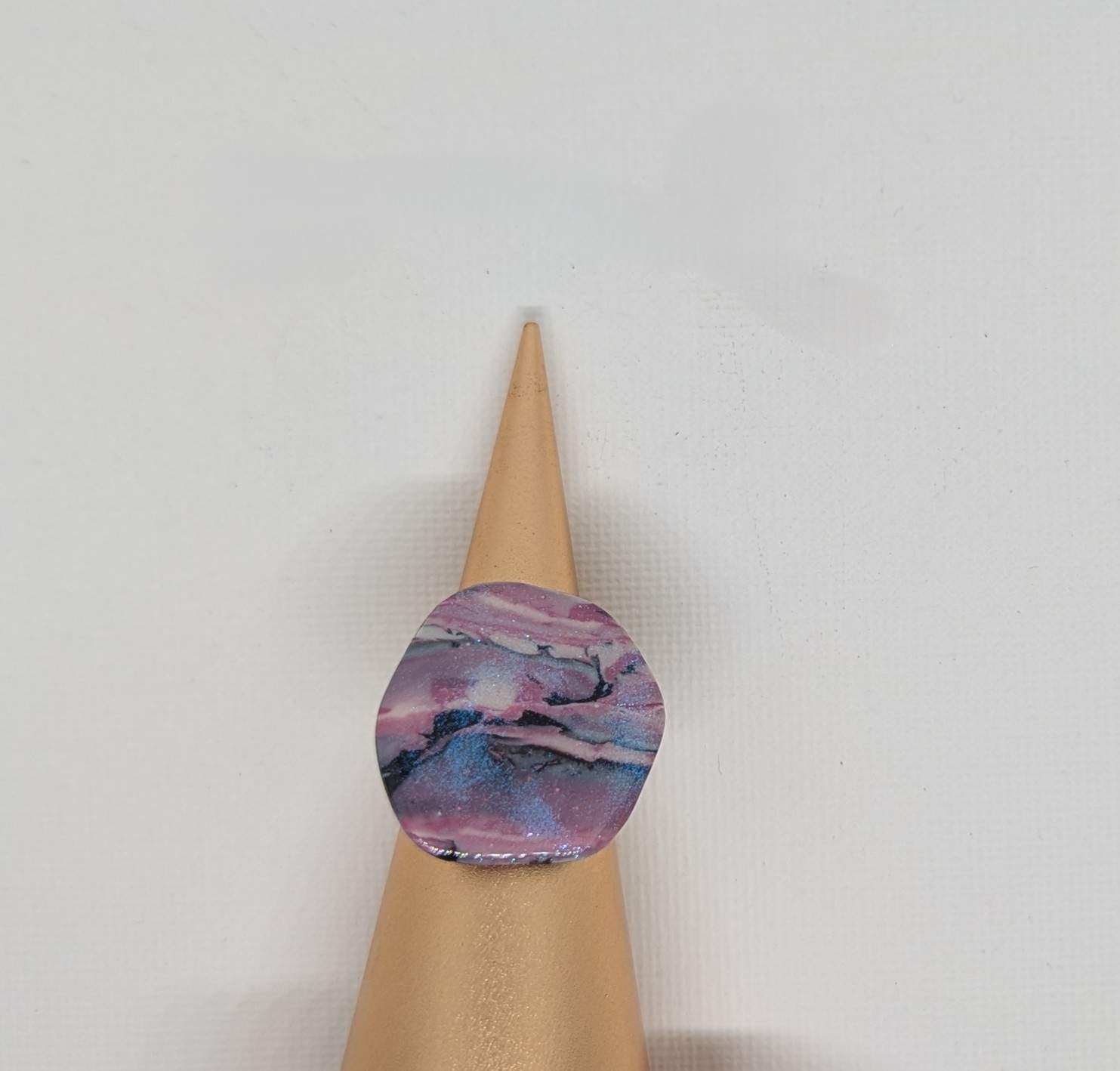 Pink and black marbled ring