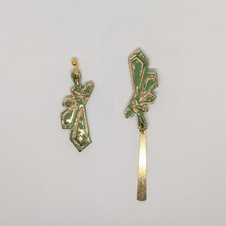 Asymmetrical green and golden studs